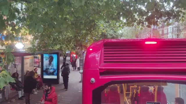 Selective view of a London bus stop, featuring the E7 bus at Ealing Broadway.